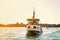 Yacht at sea against the backdrop of Venice at dawn. Sunny.