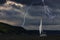 Yacht at the sea, comes nearer a thunderstorm with rain and lightning on background