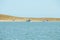 A yacht in the sea with Lambay Island in the Irish Sea. Landscapes of Ireland.