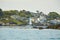 A yacht in the sea near rocky island in the Irish Sea. Landscapes of Ireland.
