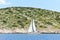 Yacht with white sail near Dalmatia coast