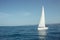 Yacht with white sails on the calm sea in good sunny day.