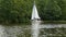 Yacht with white sails moored