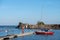 Yacht at a wooden platform in the port of Engure on the coast of the Baltic Sea