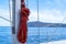 Yachting ropes on the sailing boat mast, blur sea water background
