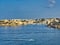 Yachts against the backdrop of a picturesque rocky shore. Copy space. Calm water - perfect for meditation. Rocks and blue sea.