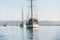 Yachts anchored in Morro Bay harbor, beautiful mountains on background