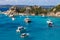 Yachts and boats in amazing azure sea water in Sardinia island