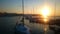 Yachts and boats docked near pier, amazing sunset and nature, golden hour