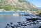 Yachts and boats are moored at the pier in the Bay of Kotor. Boating and yacht. Vacation at sea. Selective focus