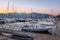 Yachts and boats on the pier of the city of Tivat, Montenegro, the Balkans, the Bay of Kotor, the Adriatic Sea. Mountains and suns