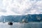 Yachts and boats sail in the Bay of Kotor around the island of Gospa od Skrpjela. Montenegro