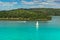 Yachts and boats sailing across the blue water in sunny summer day. Travel picturesque landscape. Yachting on windy day.Speed boat