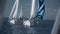 Yachts compete in a regatta race. Yachts make a turn and one of them overtakes another. Yacht with striped sail rush