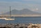 Yachts in dock against Vesuvius volcano. Boats in harbour in Naples Napoli, Italy. Sailing and travel concept. Neapolitan landmark