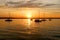 Yachts drifting on the lake during beautiful summer sunset.