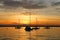 Yachts drifting on the lake during beautiful summer sunset.