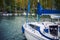 Yachts with folded sails on the shore near the pier.