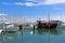 Yachts in Larnaca port, Cyprus. One black boat is different from the others - it looks like a pirate ship