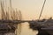 Yachts in a marina at the sunset.