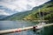 yachts moored in calm harbour and beautiful mountains Aurlandsfjord Flam