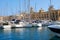 The yachts moored in the harbor in front of Malta Maritime Museum. Malta.