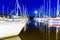 Yachts moored in a harbor at night. Sailboats in the dock. Summer vacations, cruise
