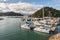 Yachts moored in Picton marina with Marlborough Sounds in background, New Zealand