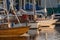 Yachts and pleasure boats parked with anchor in the harbour.