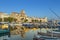 Yachts reflecting in blue water in the old town port of La Ciotat, Marseilles district, France, in the evening light