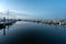 Yachts and sailboats docked in Dinner Key Marina in Miami in morning twilight.