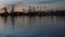 Yachts sailboats in marina harbour. Sail boat masts in twilight. Dusk in harbor, California USA.