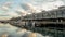 Yachts and small motor boats moor along the Woolloomooloo wharf in Sydney harbour, Sydney Australia