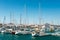 Yachts with their masts up in city harbor, Spain