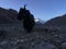 Yak in front of Rongbuk Monastery during Sunrise in Himalayan Mountains in Tibet in China.