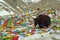 Yak walks by prayer flags on Drolma La Pass.