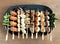 Yakitori: Japanese bite-sized food skewers: asparagus, sausage, scallop, squid, mushroom, prawns, chicken, pork, beef and okra