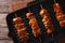 Yakitori skewers of chicken on a grill pan close-up. horizontal