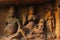 Yaksha Jambhala sits with his wife, Hariti, who holds one of her five hundred children on her lap, Cave 8, Ellora Caves,