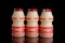 Yakult fermented milk drink on black isolated background