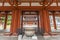 Yakushi-Ji temple. Jokoro incense burner at Chumon gate, Kondo (Main hall) in the back.