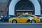 Yandex taxi branded car driving against Moscow undeground