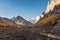 Yangmaiyong holy mountain in autumn valley on peak at Yading nature reserve