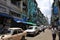 Yangon downtown street with old houses and cars