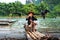 Yangshuo, China - July 27, 2018: Cormorant fisherman on a bamboo rafts on Li river in Yangshuo near Guilin in China