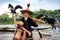 Yangshuo, China - July 27, 2018: Cormorant fisherman on a bamboo rafts on Li river in Yangshuo near Guilin in China