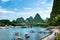 Yangshuo, China - July 27, 2018: Tourist bamboo rafts on Li river in Yangshuo near Guilin in China