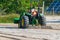 Yankee Springs, MI - July 22, 2023: Tractor cleans the sand by raking it and picking up debri on the beach