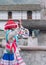 YANQUE, COLCA VALLEY, PERU - JANUARY 20, 2018:  Peruvian child with traditional costume dances in Yanque, Peru