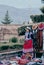 YANQUE, COLCA VALLEY, PERU - JANUARY 20, 2018: Peruvian  woman in tradicional clothes selling handmades textiles and crafts in